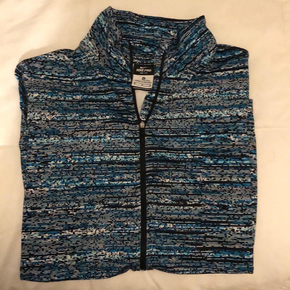 Size medium woman’s Nike 3/4 zip running jacket